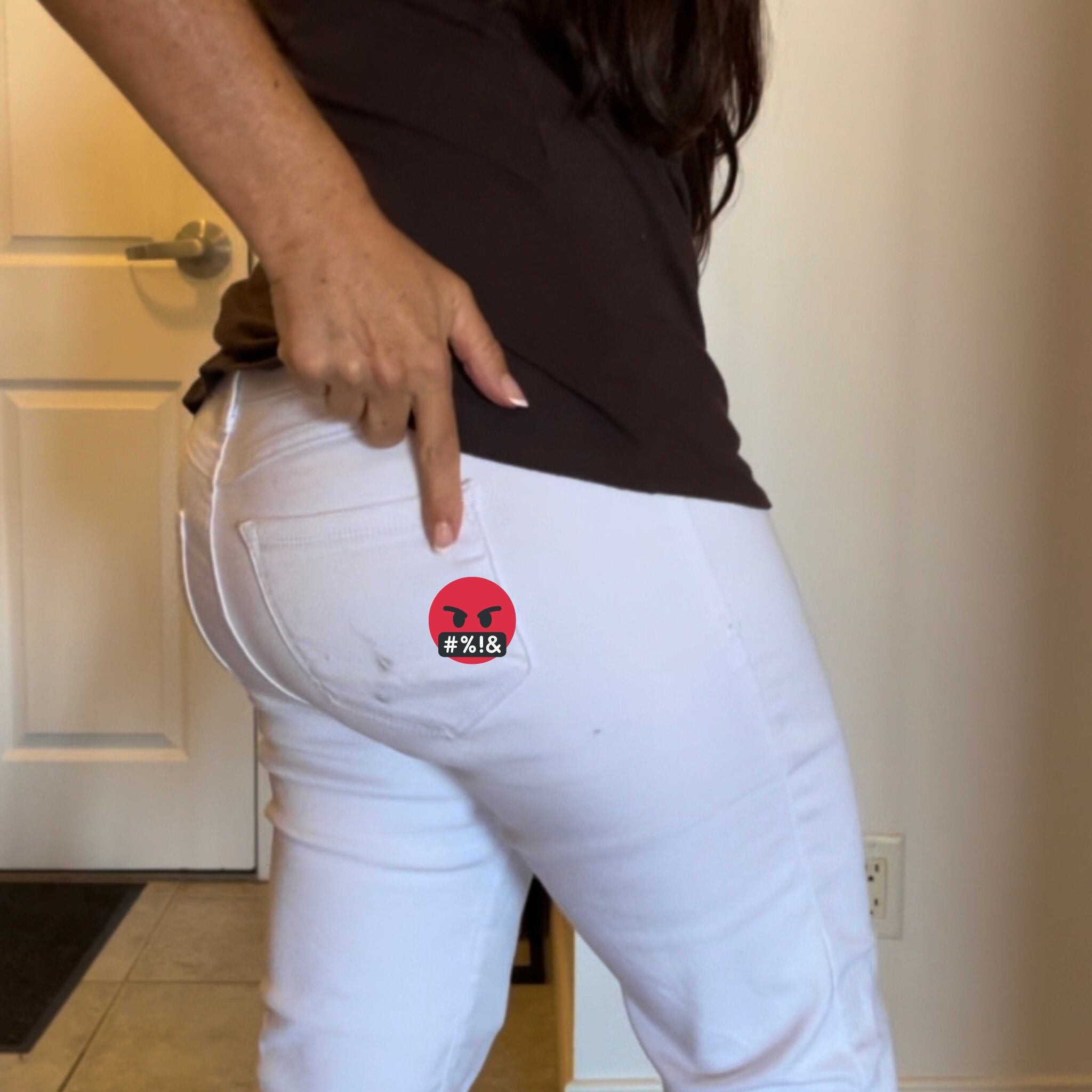 Seat Square | Image of woman wearing white pants pointing to a dark stain on butt from an Uber car seat