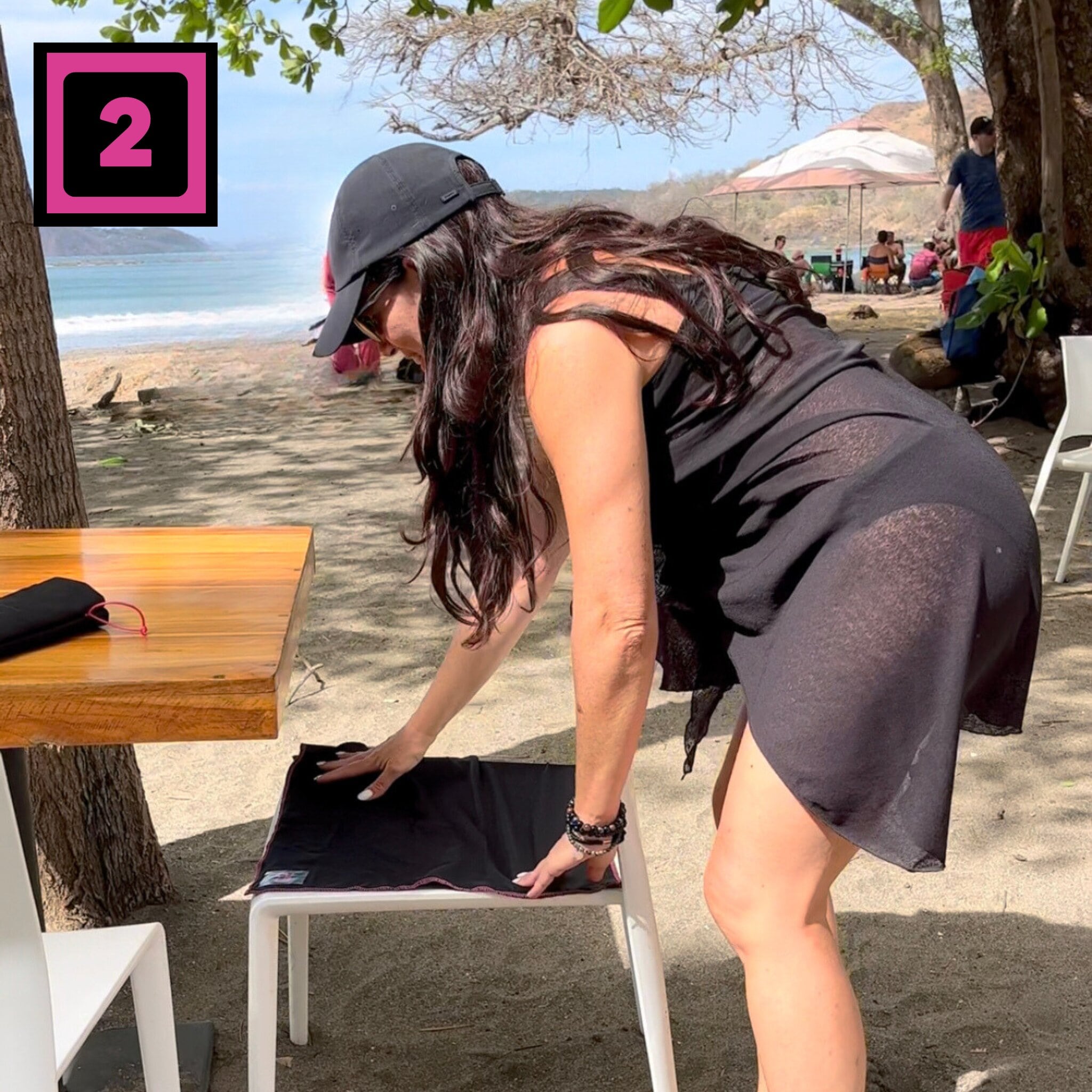 Seat Square | Woman at restaurant on beach placing Seat Square on table chair