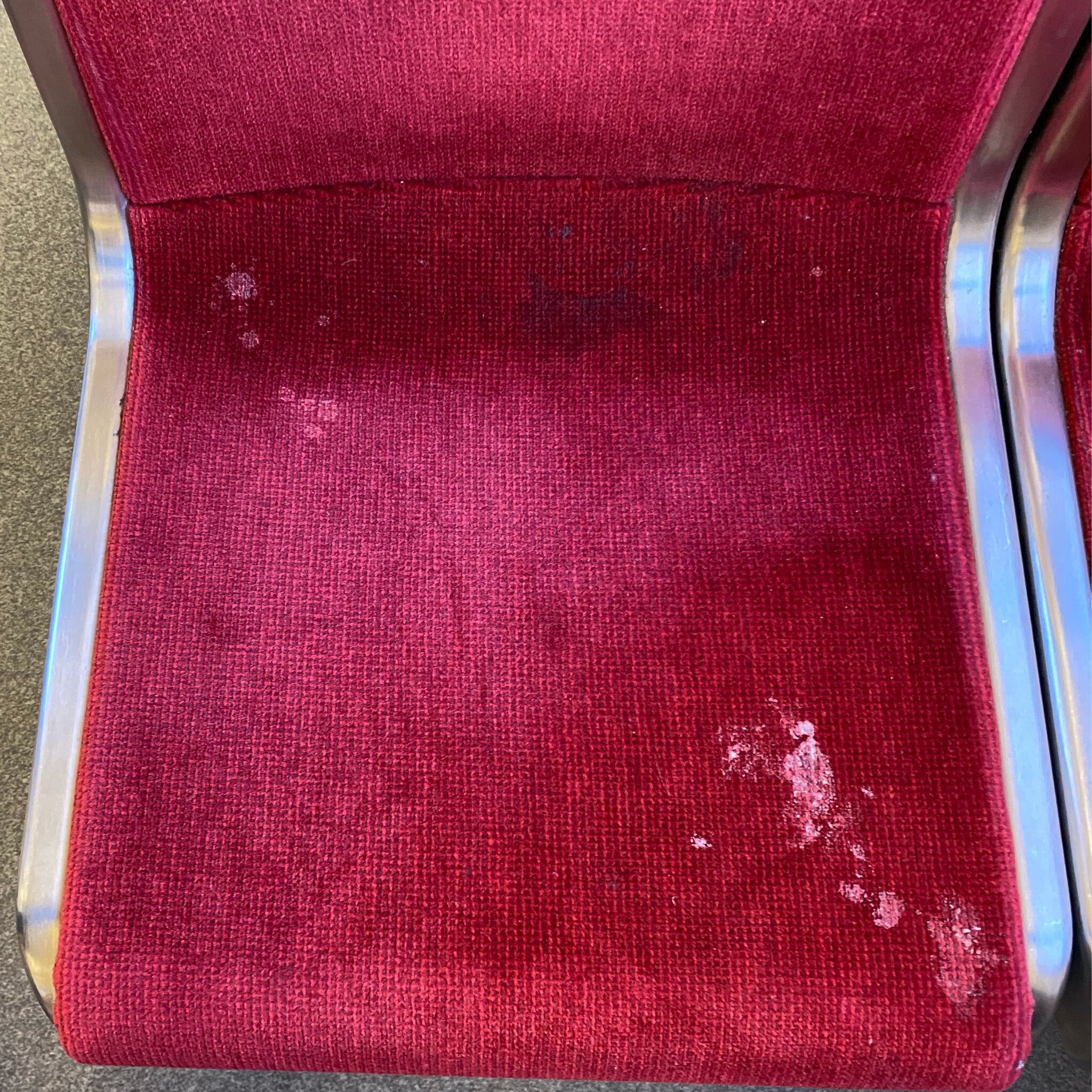 Seat Square | Dirty public transit seat with vomit, spilled liquid, random nasty stuff, and other stains. Meant to show a seat surface that needs Seat Square